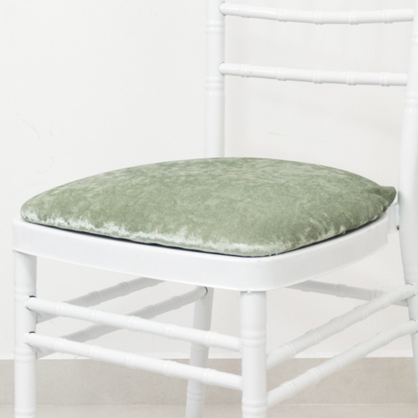 Sage green crushed velvet seat pad cover for Chiavari chair.