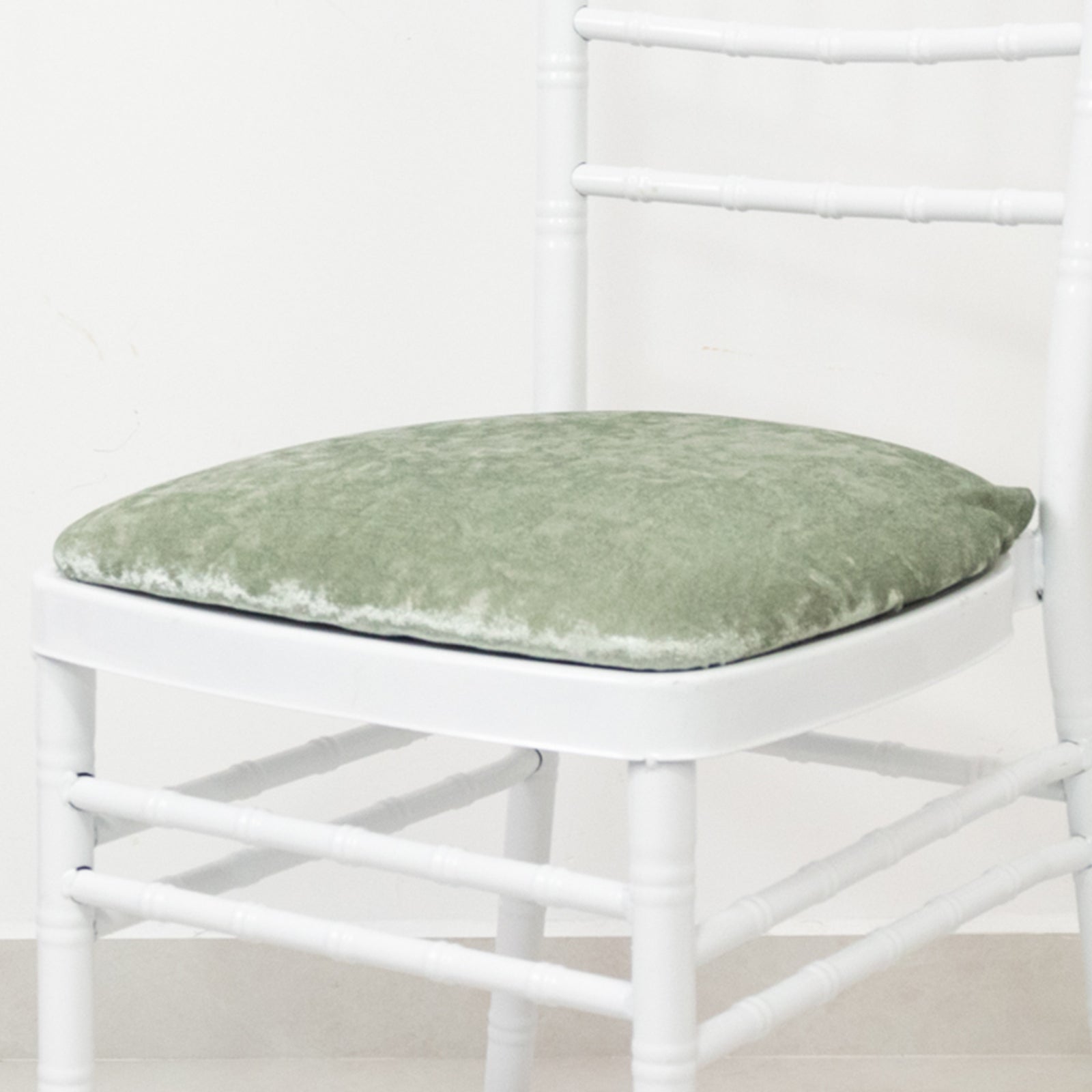 Sage green crushed velvet seat pad cover for Chiavari chair.