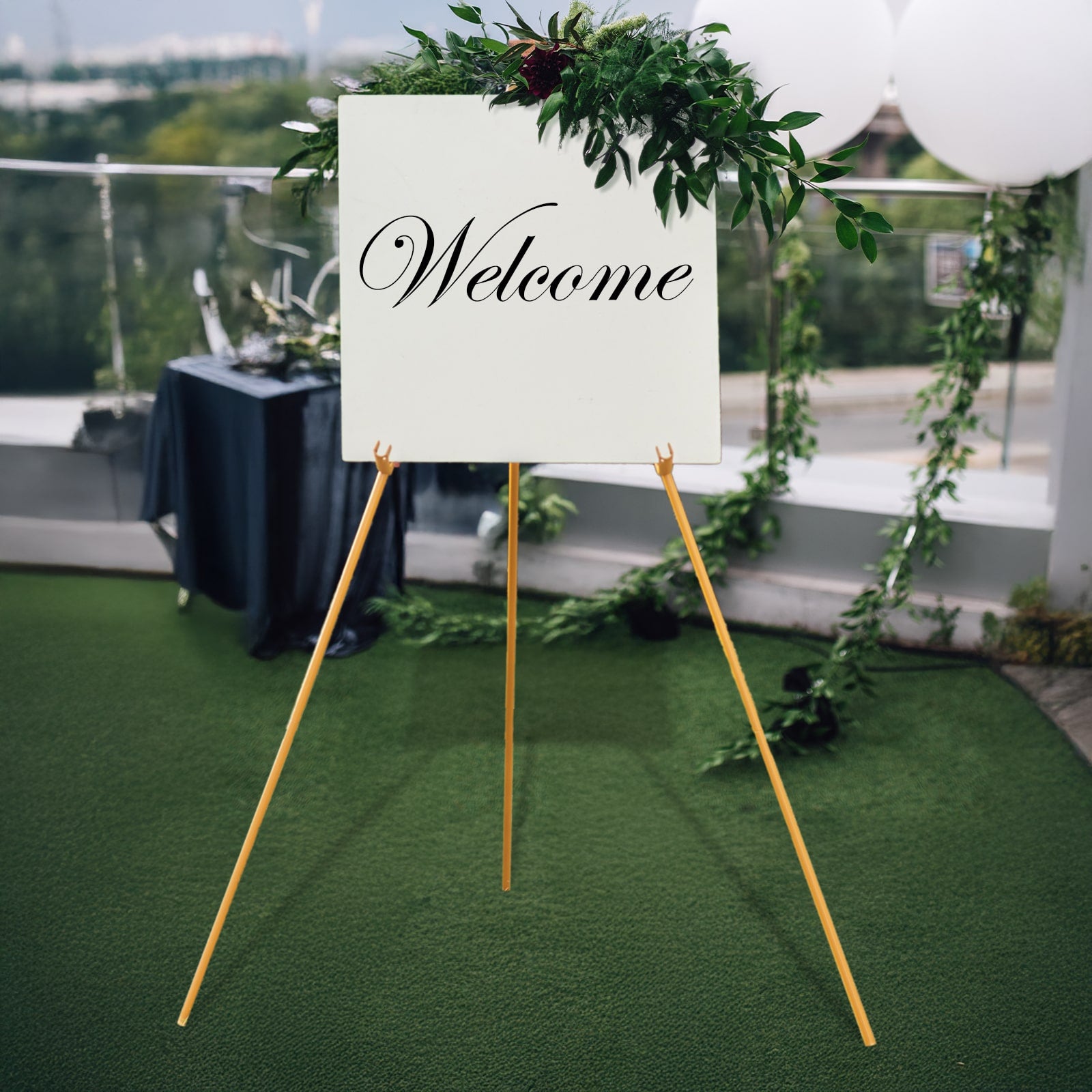 Gold metal easel stand for wedding signs and art.
