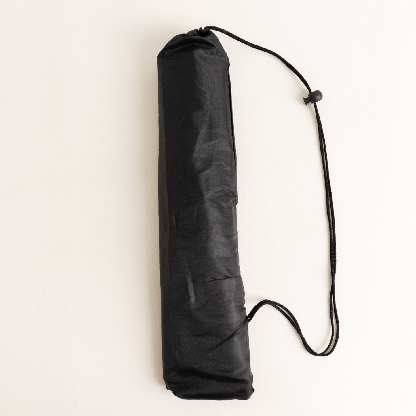 Black collapsible tripod stand for signs, 65 inches tall.