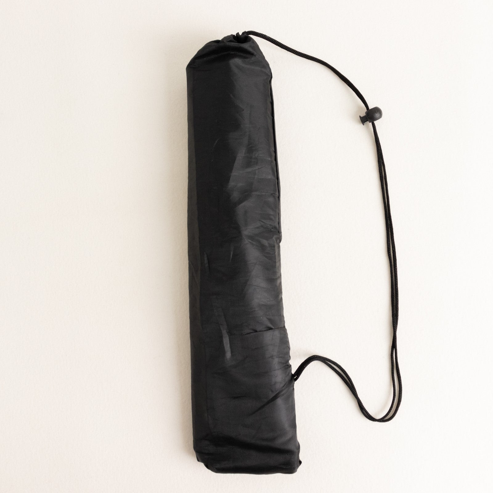 Black collapsible tripod stand for signs, 65 inches tall.