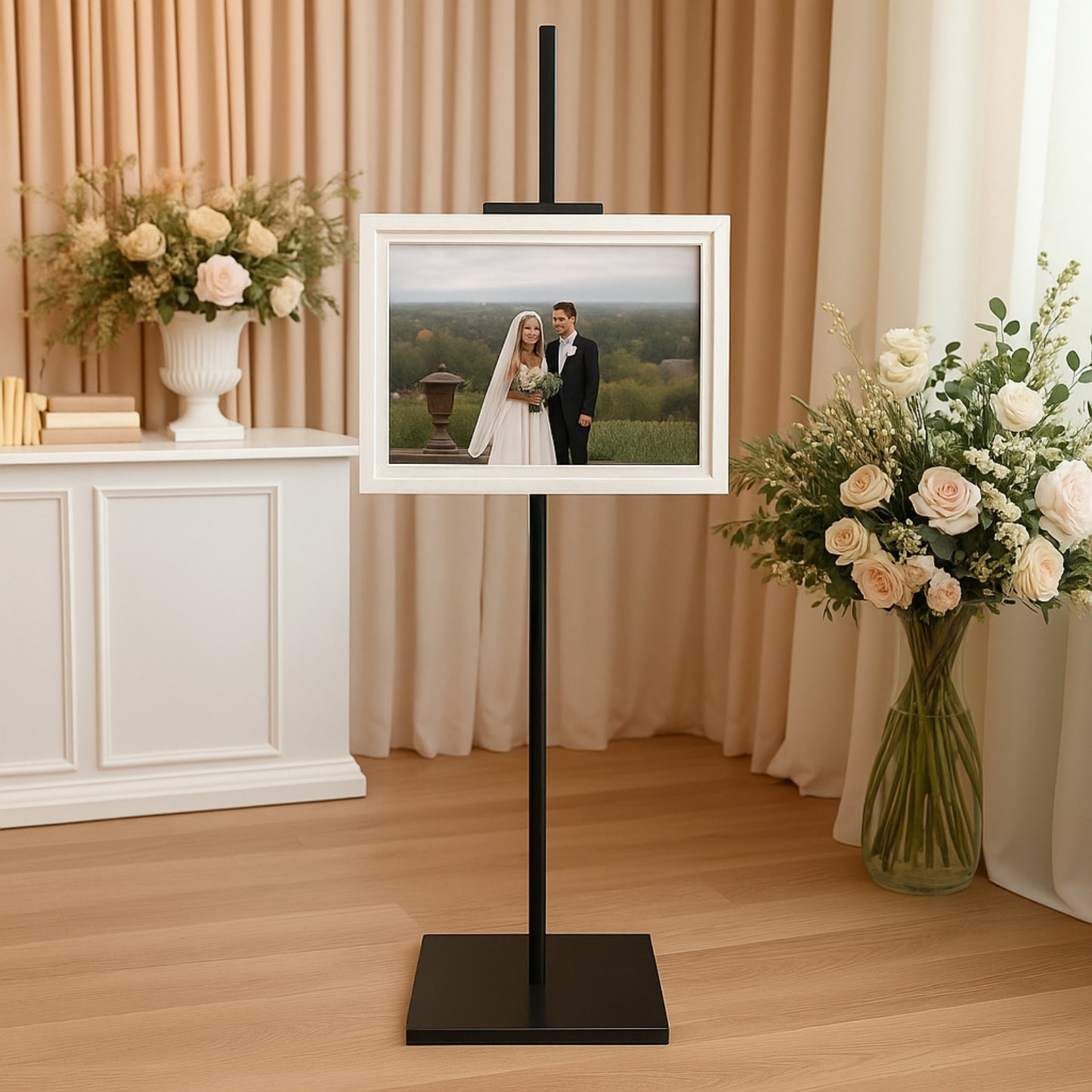 Black metal display easel stand for artwork and frames.