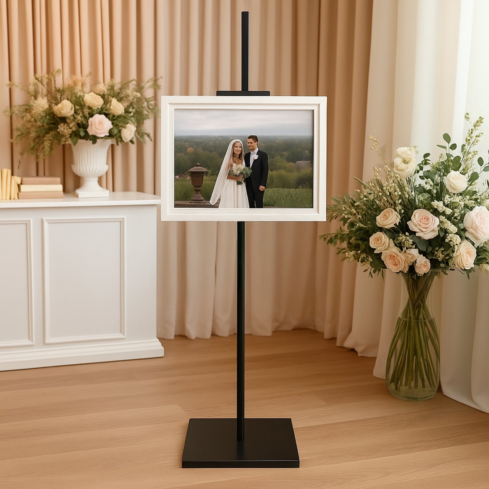 Black metal display easel stand for artwork and frames.