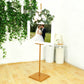 Gold metal easel stand for displaying frames and artwork.