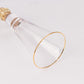 Gold rim crystal champagne flute glass with studded rhinestones.