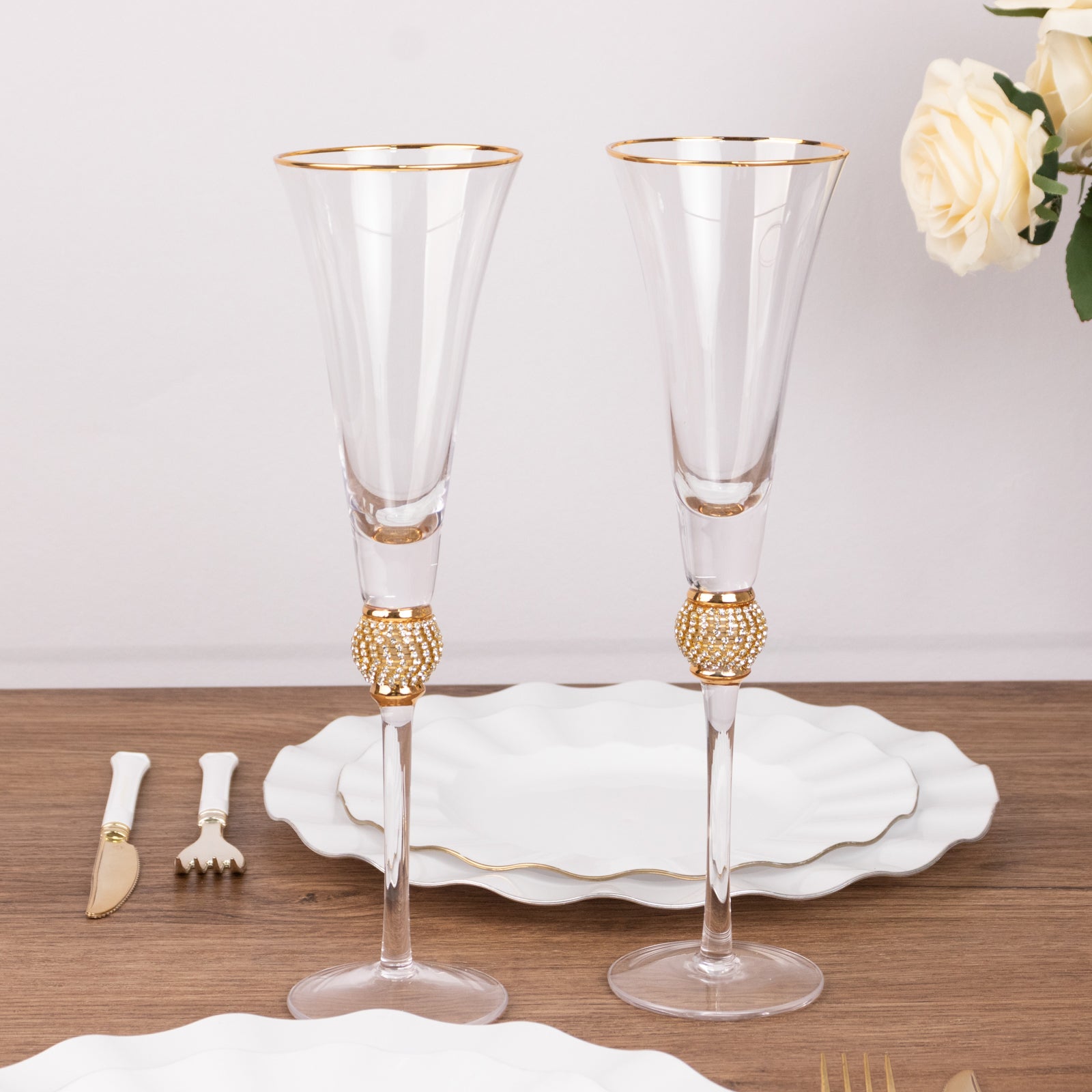 Gold rim crystal champagne flute glasses with studded diamond rhinestones.