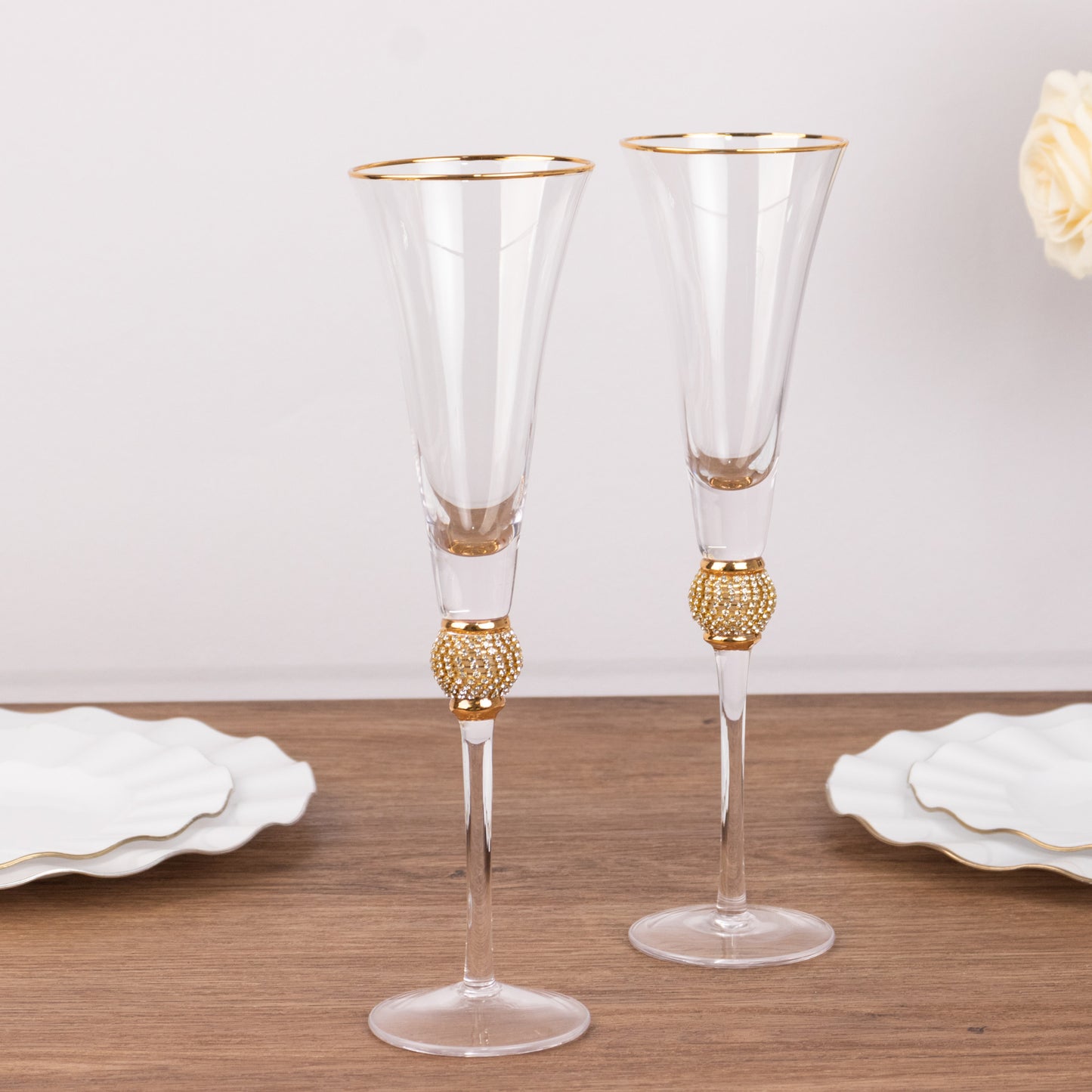 Gold rim crystal champagne flute glasses with studded rhinestones.