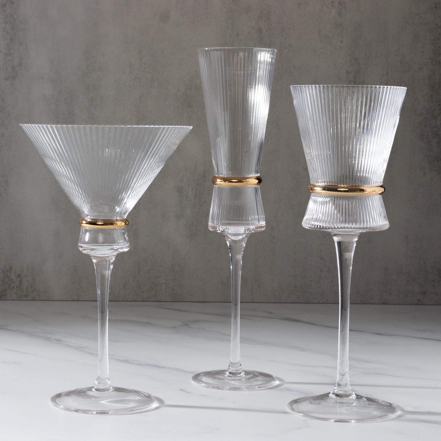 Clear champagne flutes with gold ring accents, elegant for celebrations.