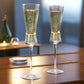 Clear champagne flutes with gold accents, perfect for celebrations.