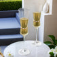 Clear champagne flutes with gold accents, elegant glassware for celebrations.