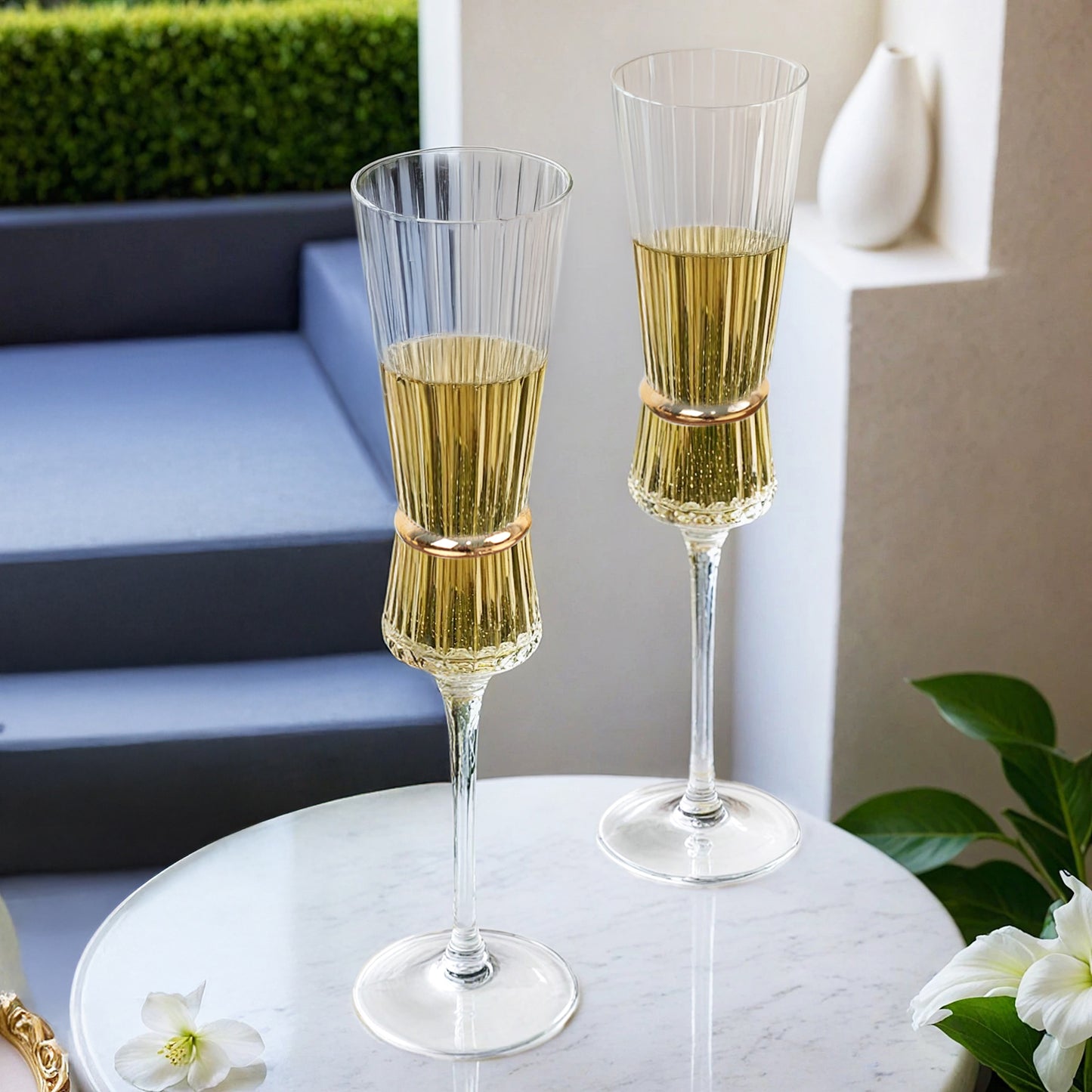 Clear champagne flutes with gold accents, elegant glassware for celebrations.