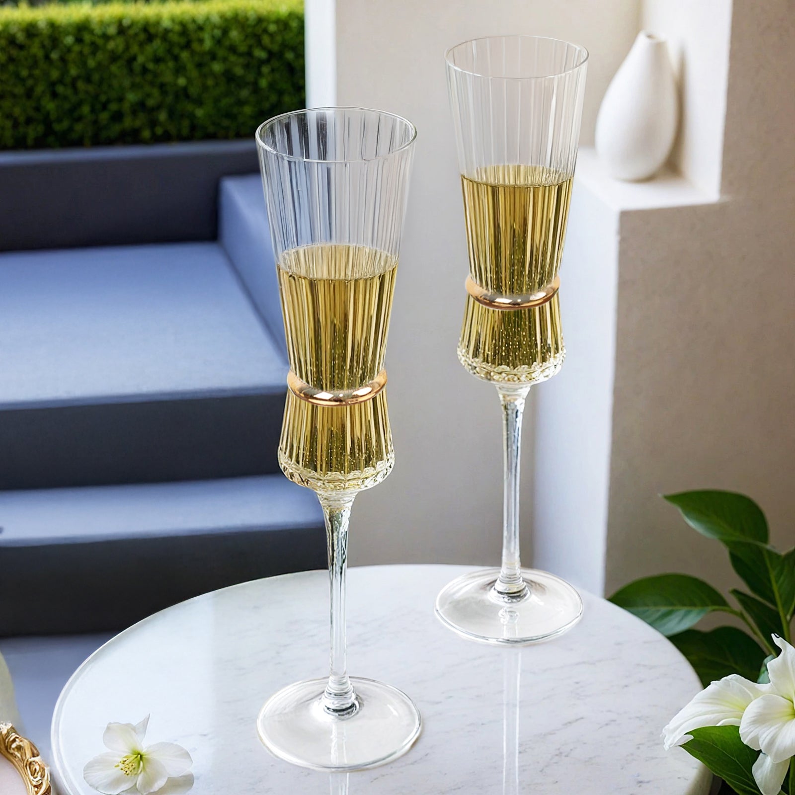 Clear champagne flutes with gold accents, elegant glassware for celebrations.