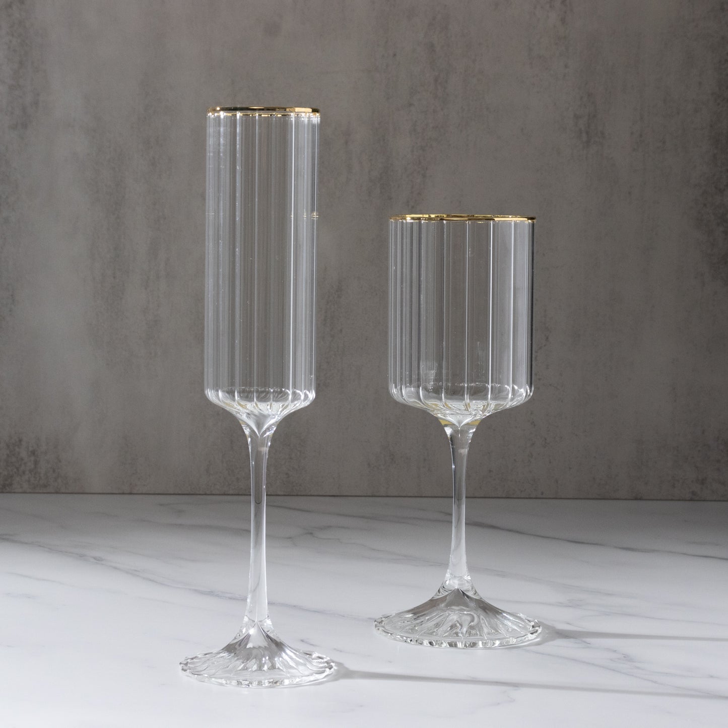 Clear modern champagne flutes with gold rim, elegant for celebrations.