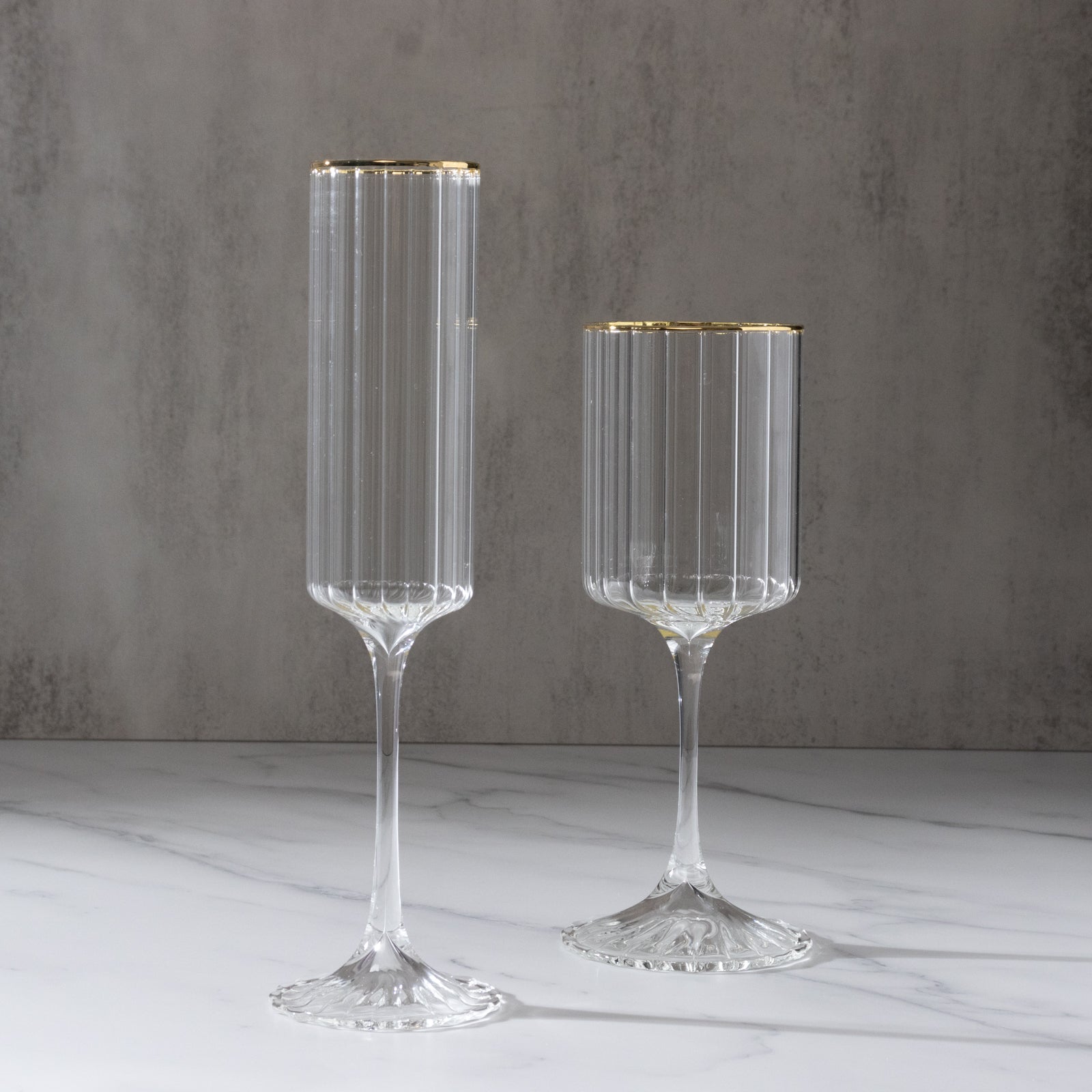 Clear modern champagne flutes with gold rim, elegant for celebrations.