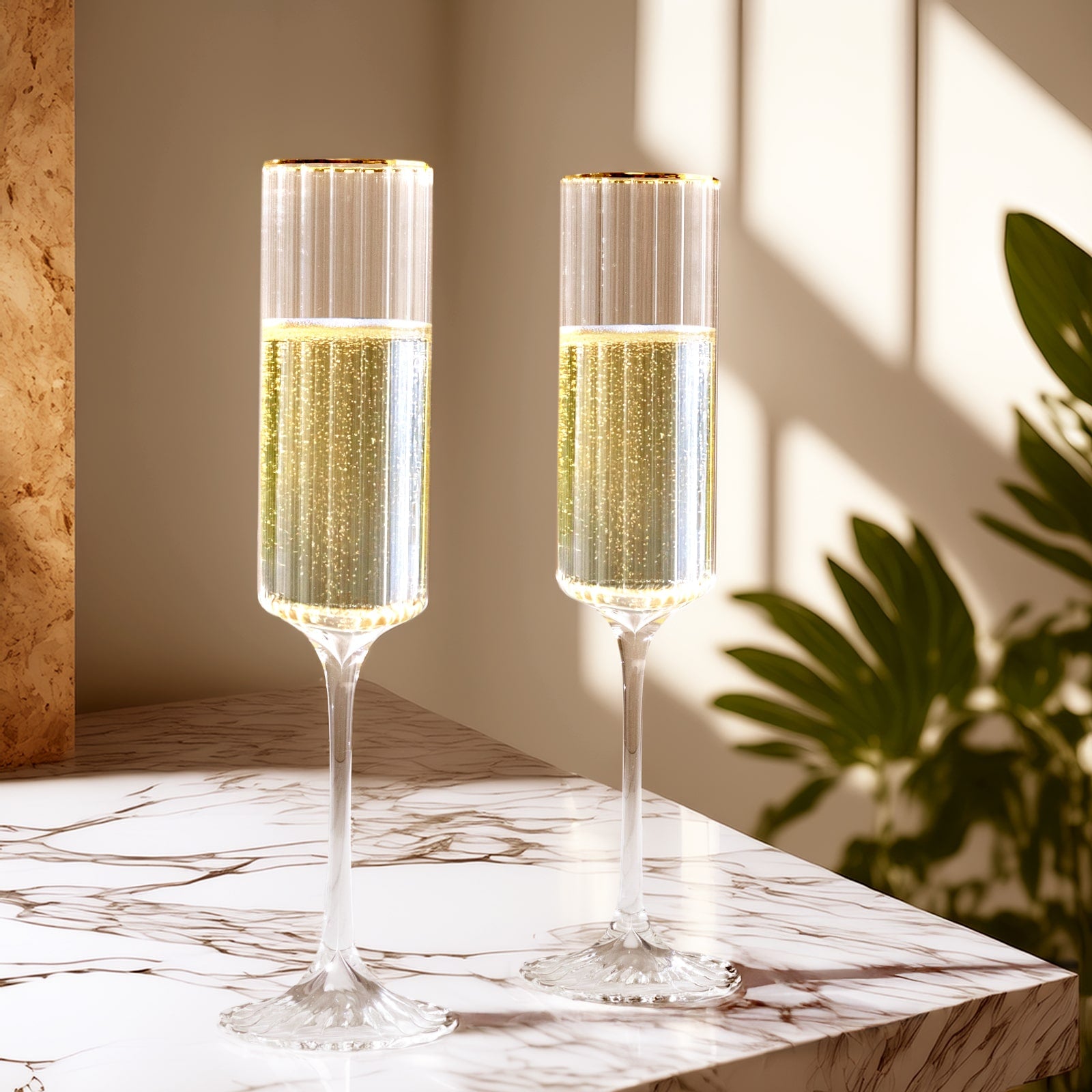 Clear modern champagne flutes with gold rim, elegant for weddings and celebrations.