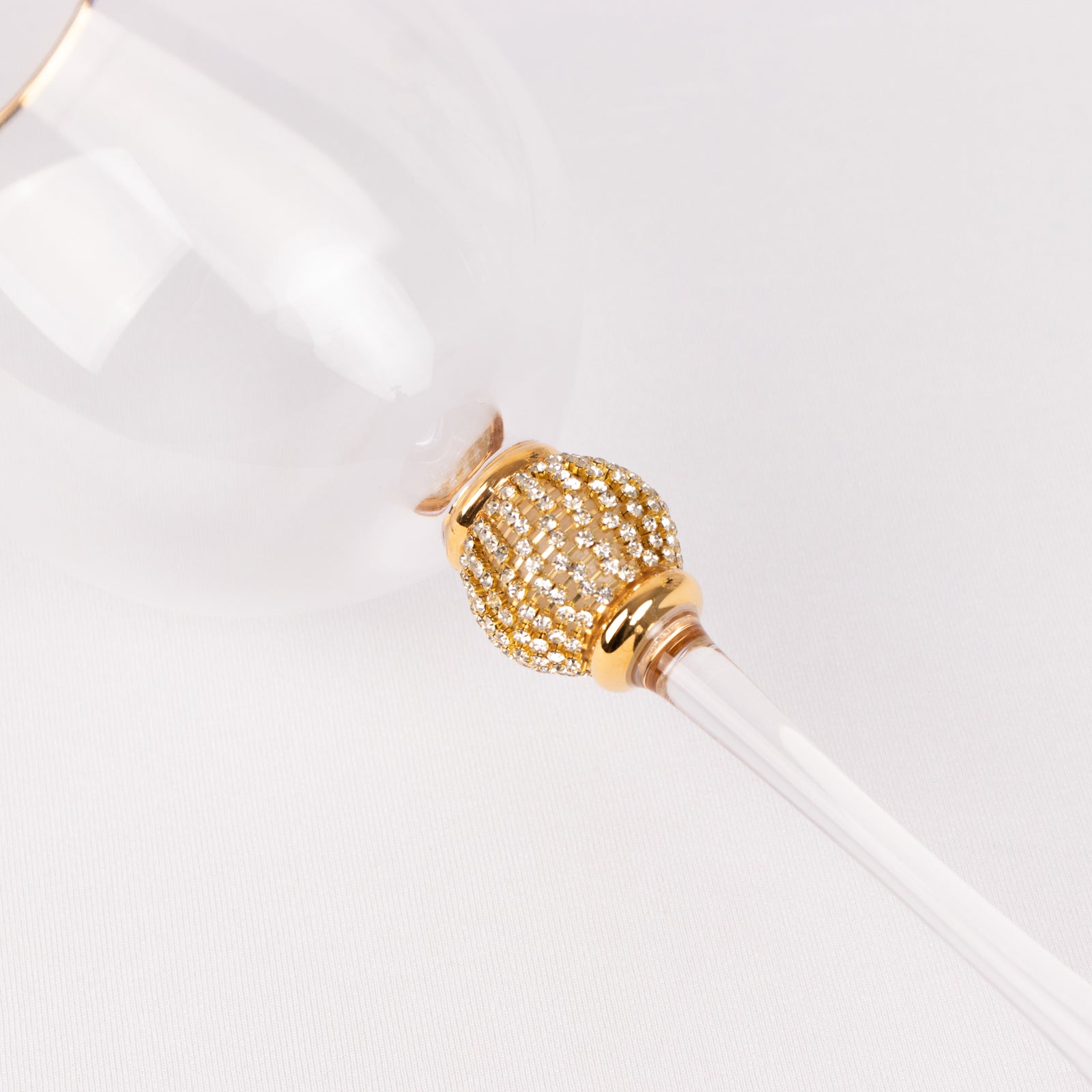 Gold rimmed crystal wine goblet with rhinestone studded stem.