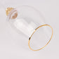 Gold rimmed crystal wine goblet glass with rhinestone studded stem.