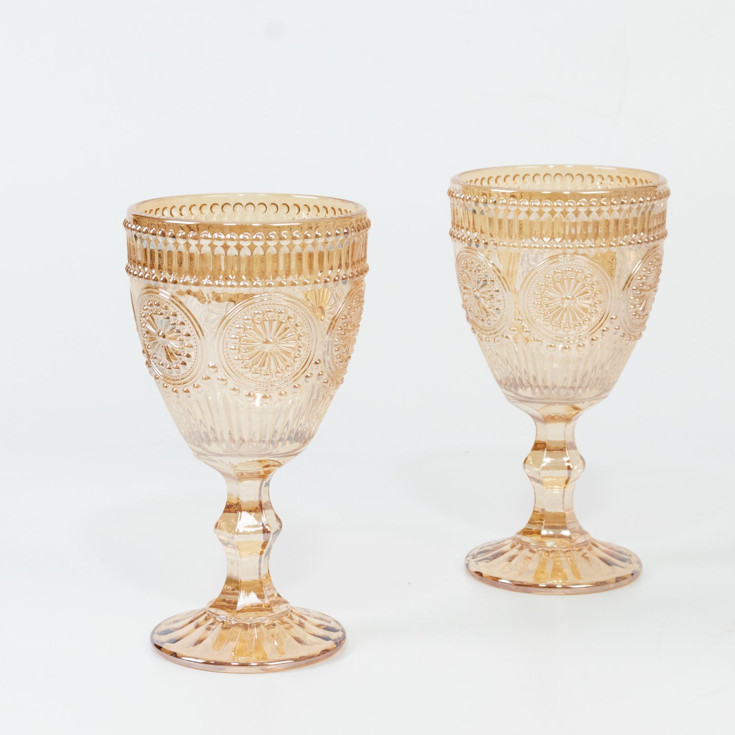Amber gold vintage embossed goblets with floral design.