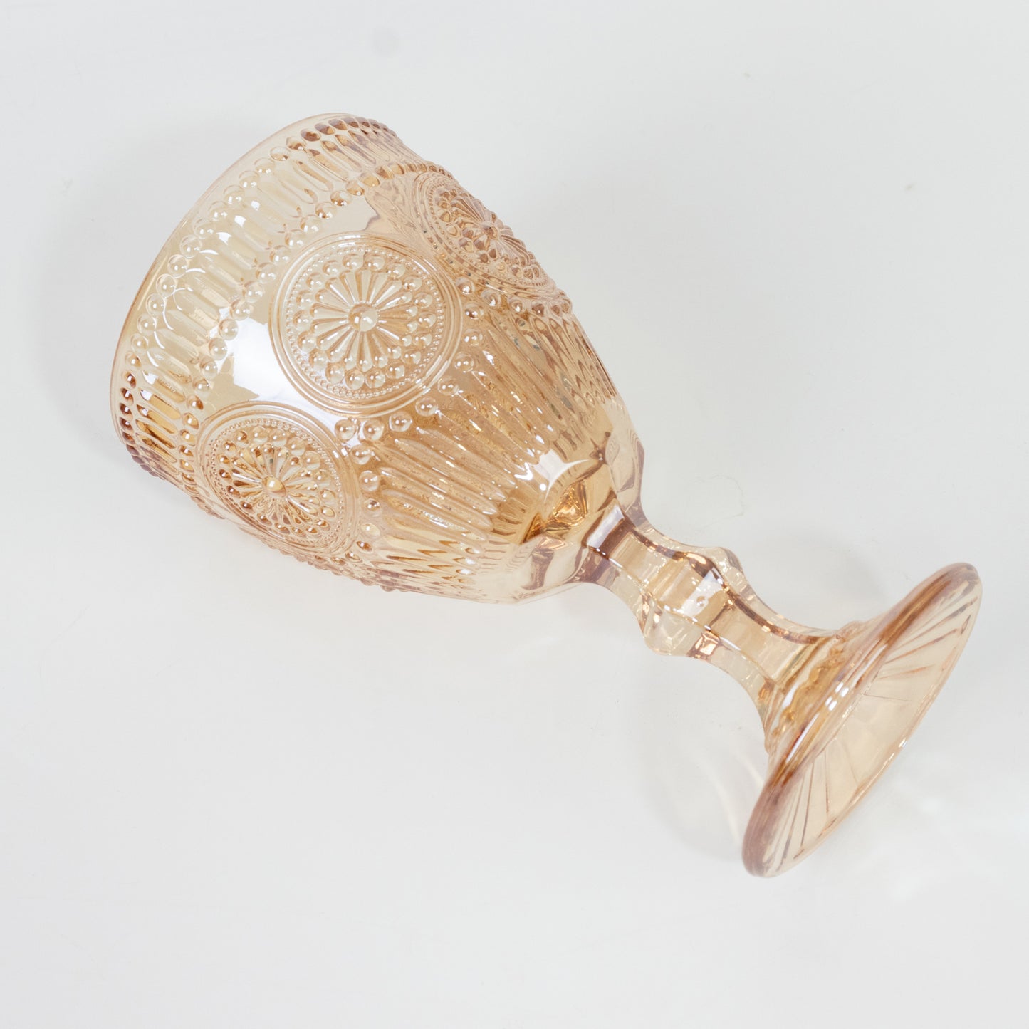 Amber gold vintage goblet with floral design, embossed glass cocktail glass.