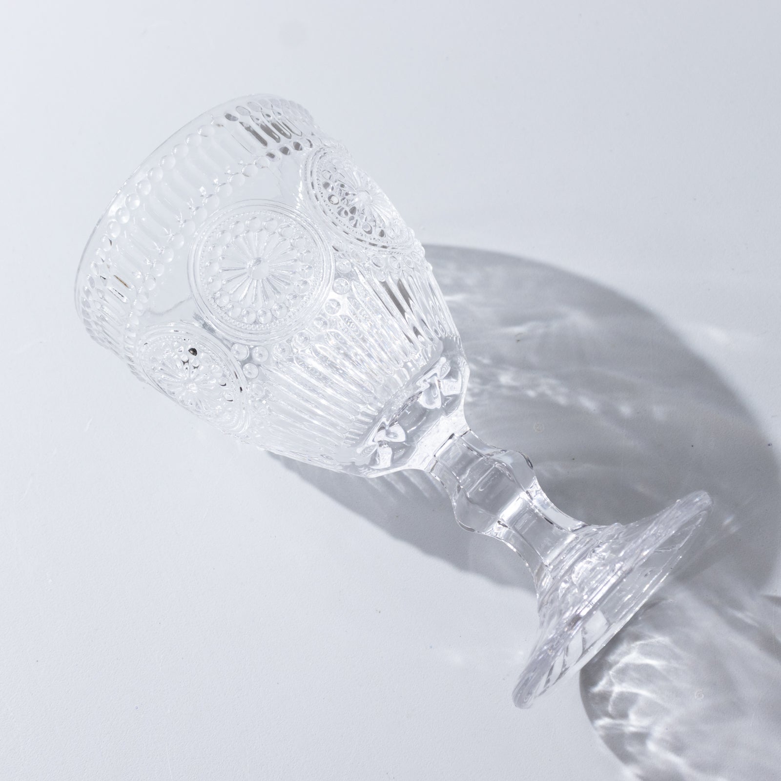 Clear vintage goblet with floral design, perfect for cocktails and wine.
