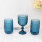 Ocean blue vintage embossed goblet wine glasses with floral pattern.