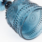 Ocean blue vintage embossed goblet wine glass with floral pattern.