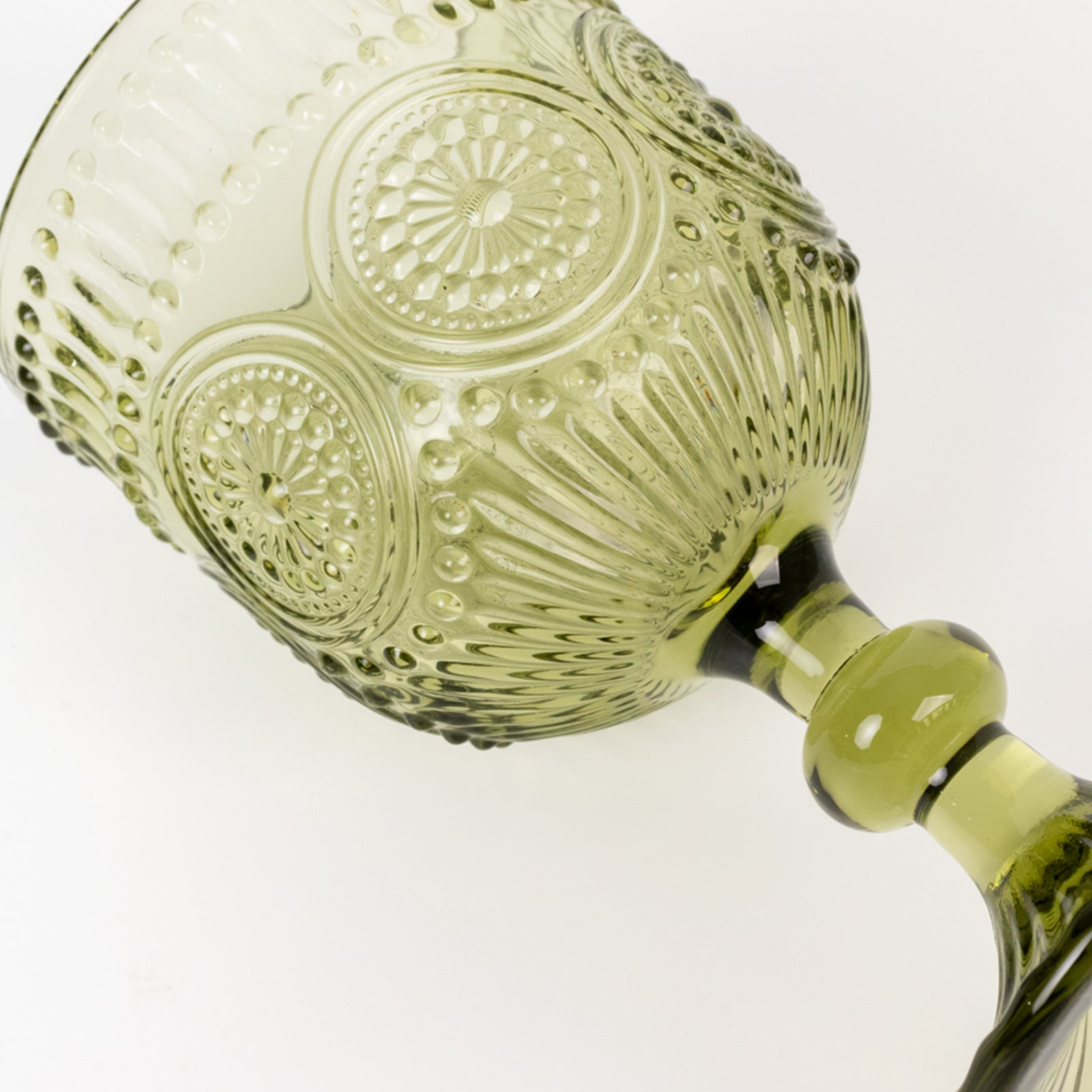 Dusty sage green vintage embossed goblet wine glass with floral pattern.