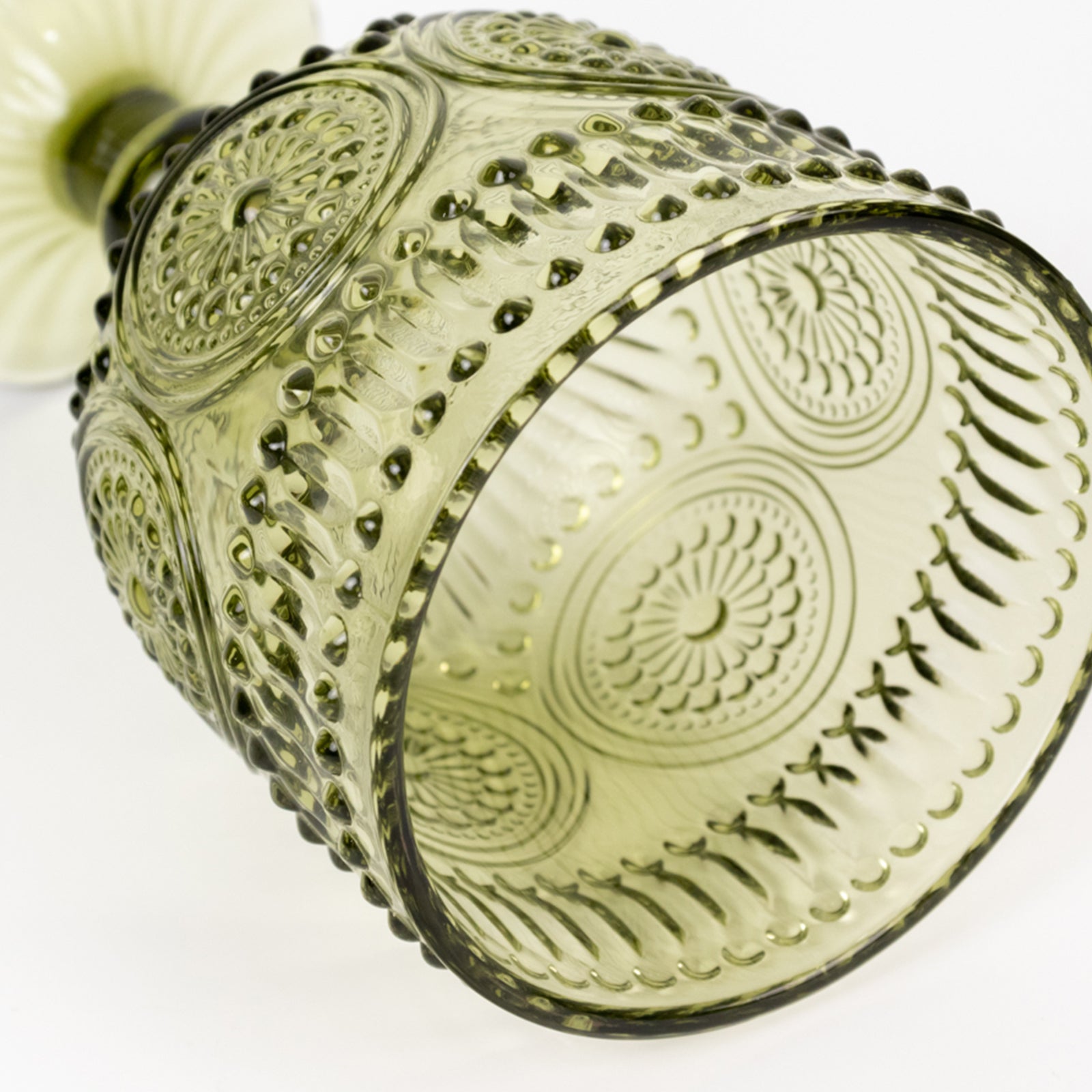 Dusty sage green vintage embossed goblet wine glass with floral pattern.