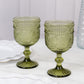 Dusty sage green vintage embossed goblet wine glasses with floral pattern.