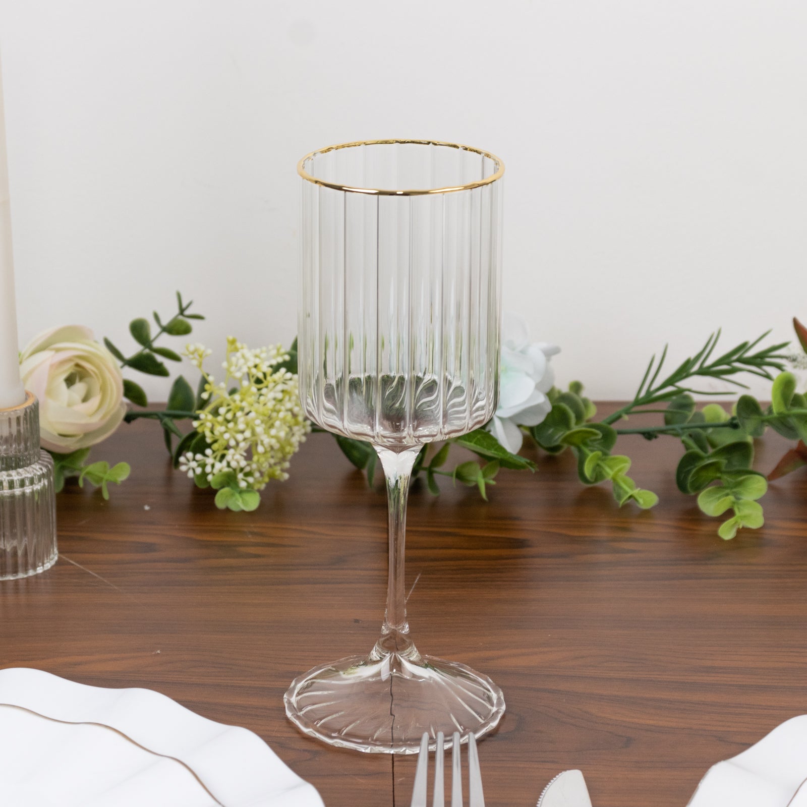 Clear glass wine goblet with gold rim, vintage style, 10oz capacity.