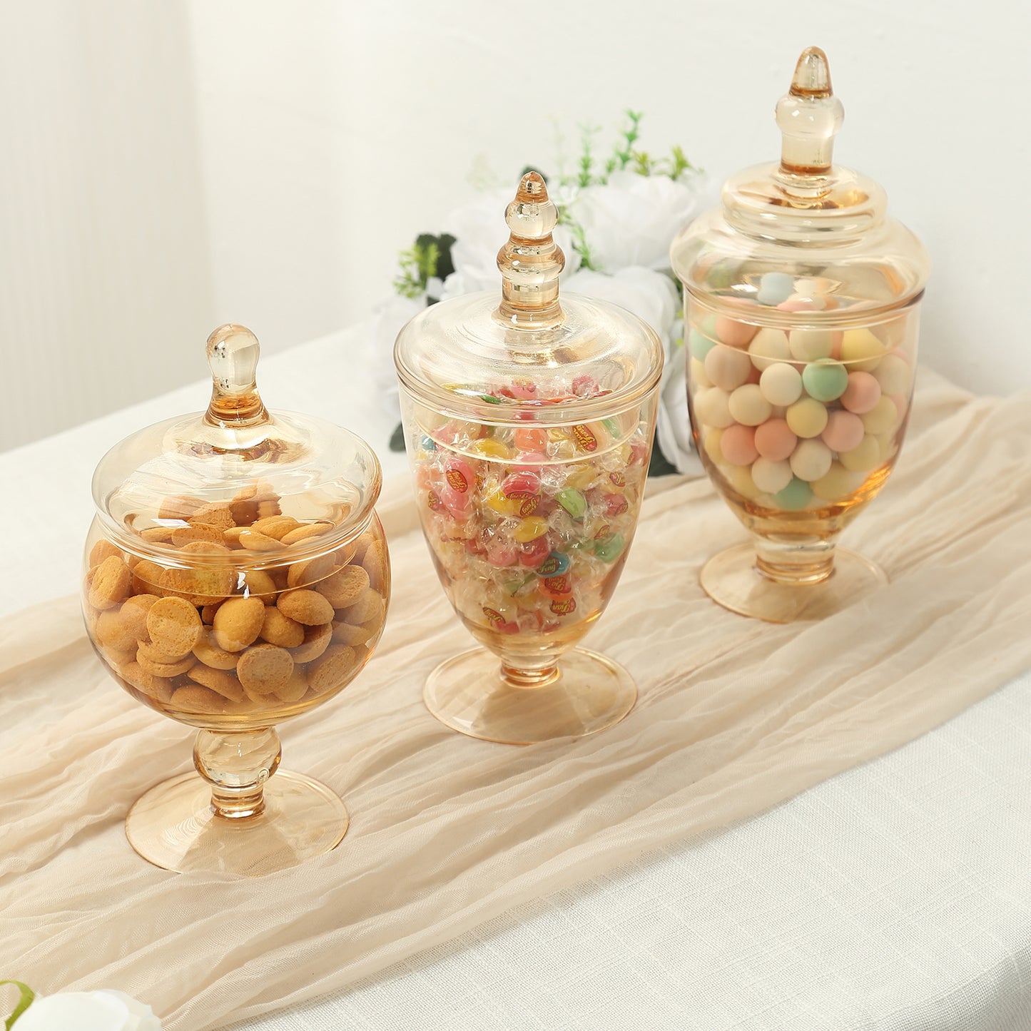 Amber gold decorative glass jars with snap-on lids for storage.