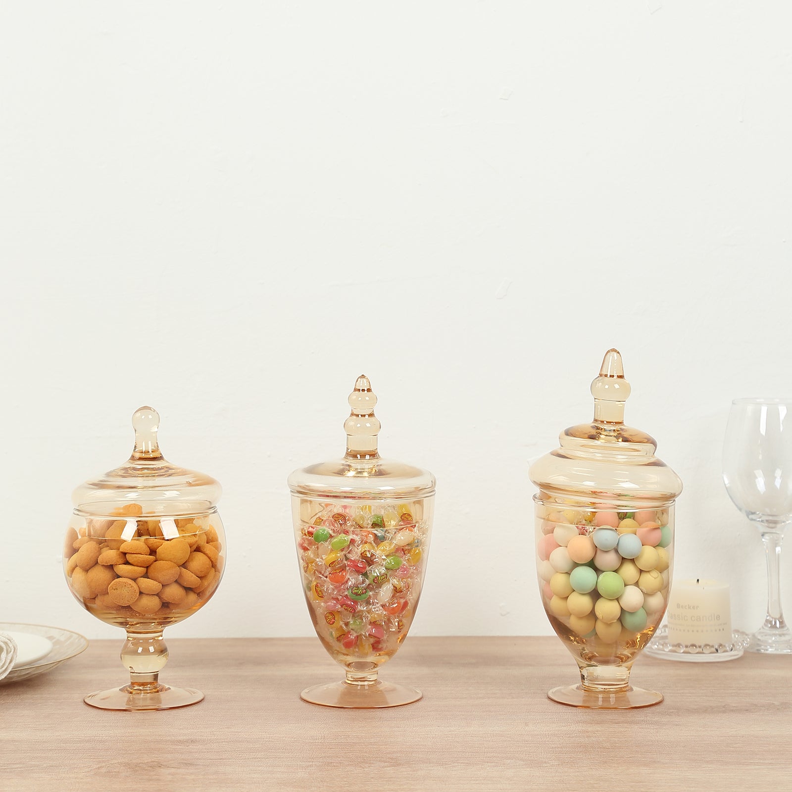 Amber gold apothecary jars with snap on lids for decorative storage.