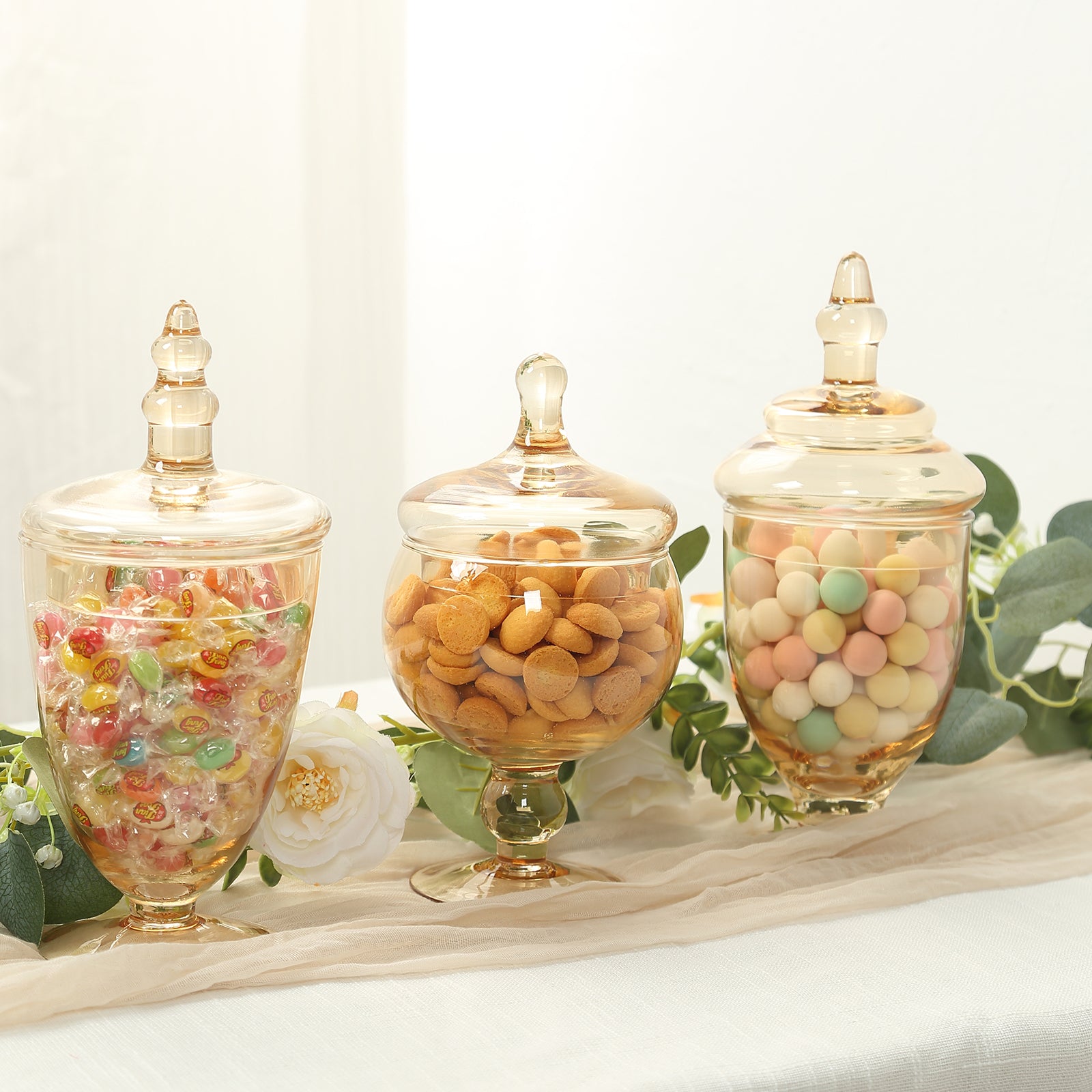 Amber gold decorative apothecary jars with snap-on lids for storage.