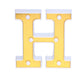 Gold 3D marquee letter "H" with warm white LED lights.