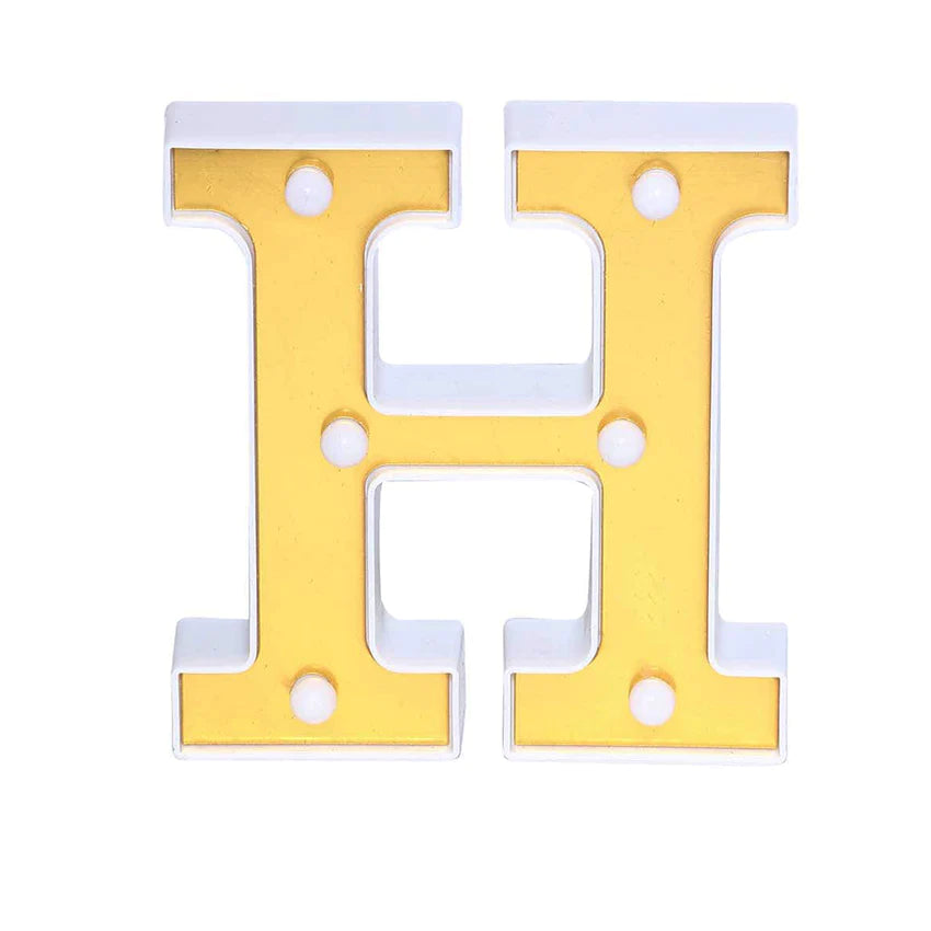 Gold 3D marquee letter "H" with warm white LED lights.