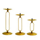 Gold metal oval frame pillar candle holders, assorted sizes, geometric table centerpieces.