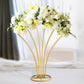 Gold metal scalloped fan-shaped flower frame centerpiece with white floral display.