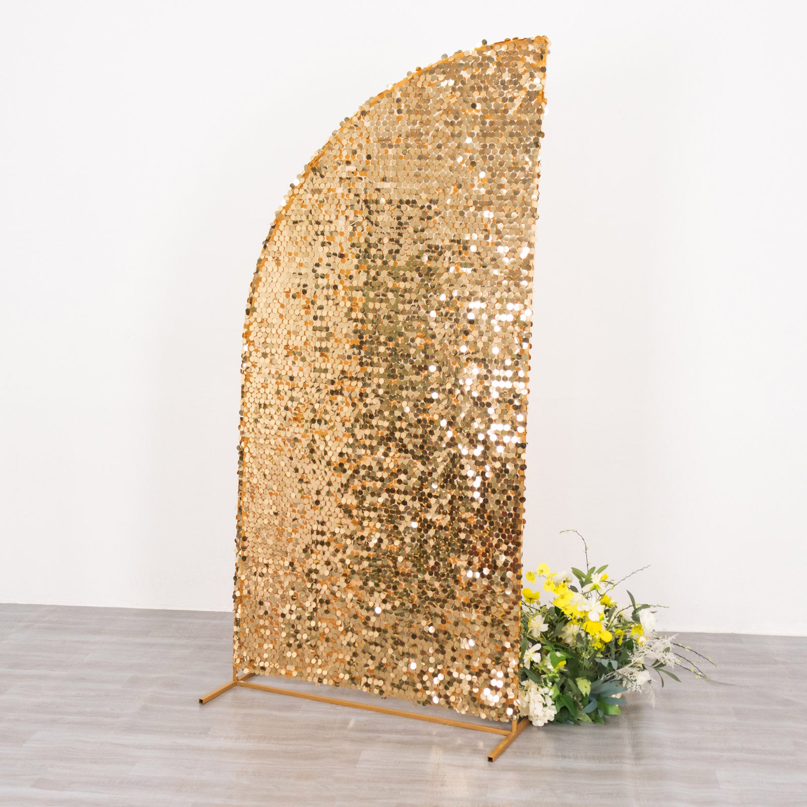 Gold sequin wedding arch cover for backdrop display.