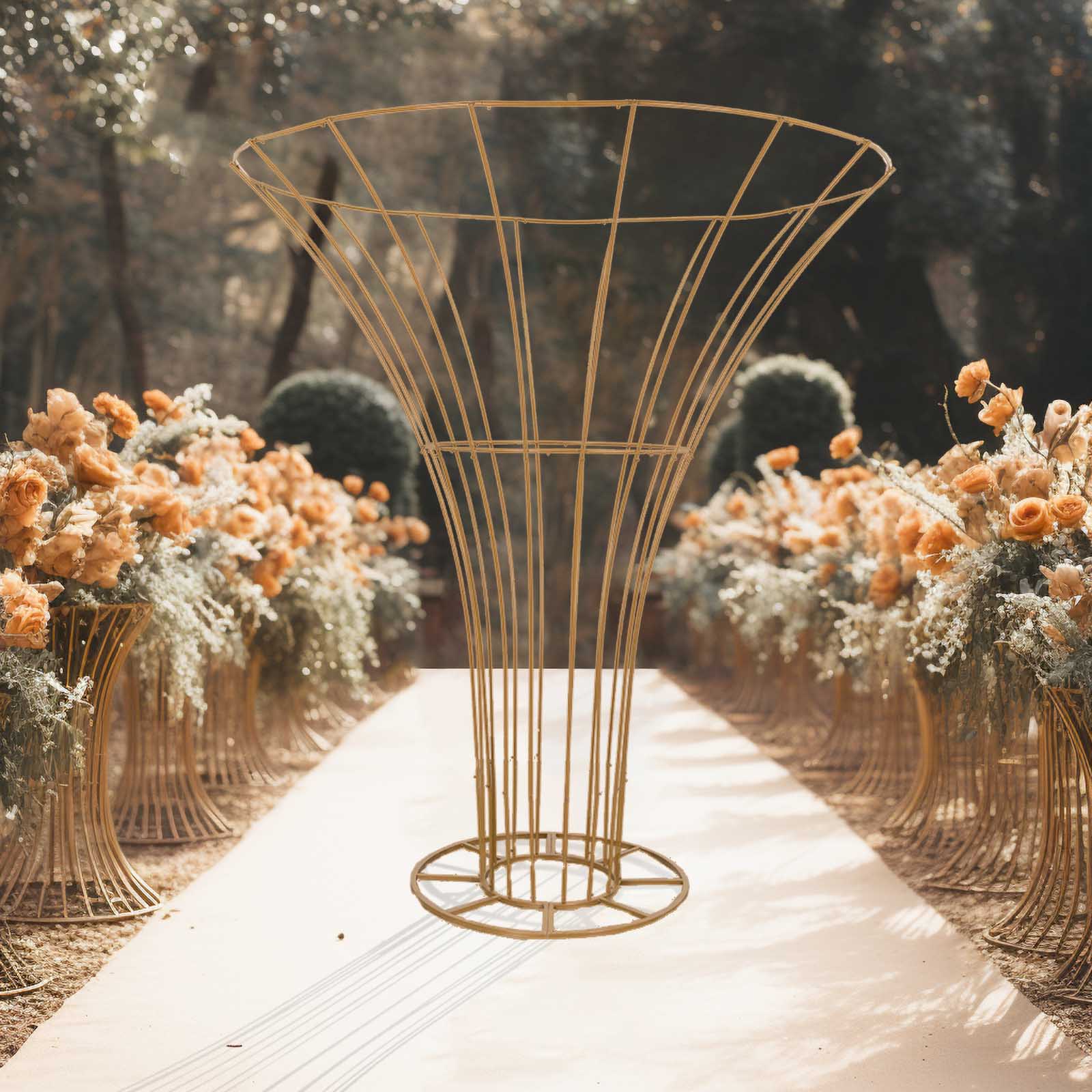 Gold floral display stand with a modern design, surrounded by peach and cream flowers.