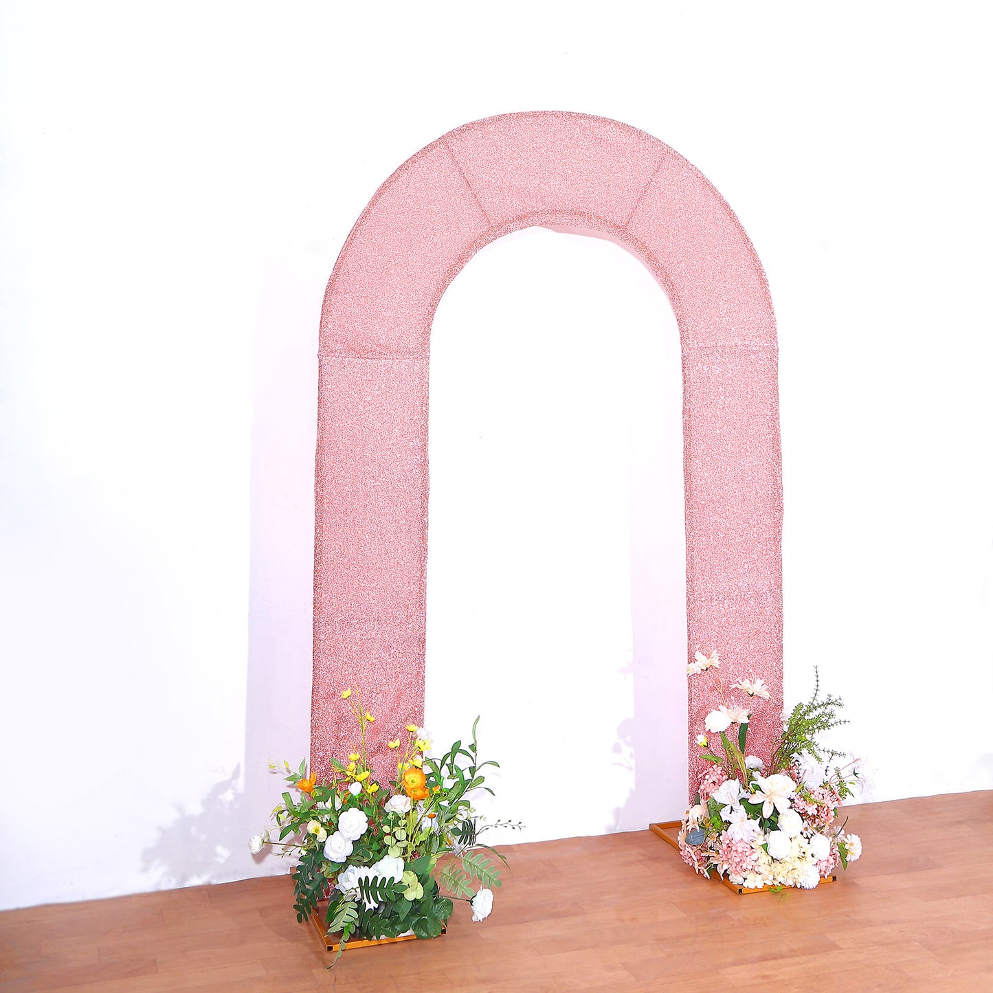 7ft rose gold shimmer tinsel wedding arch cover with floral arrangements.