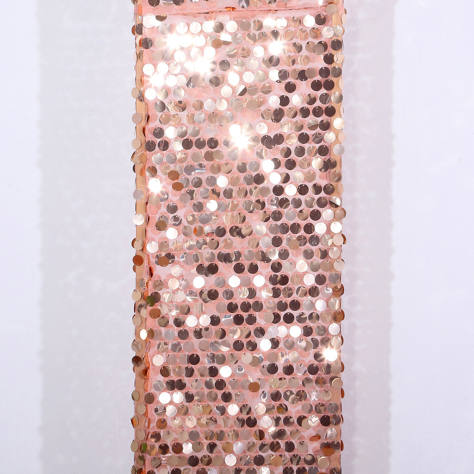 Rose gold sequin wedding arch cover with a shimmering finish.