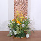 8ft rose gold sequin wedding arch cover with floral arrangement.