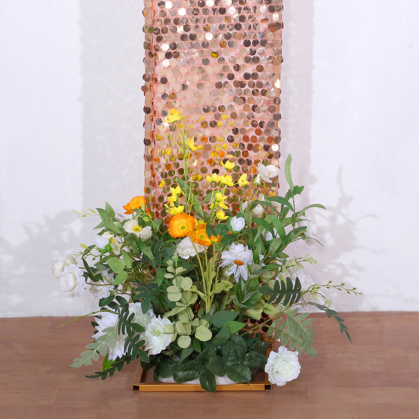 8ft rose gold sequin wedding arch cover with floral arrangement.