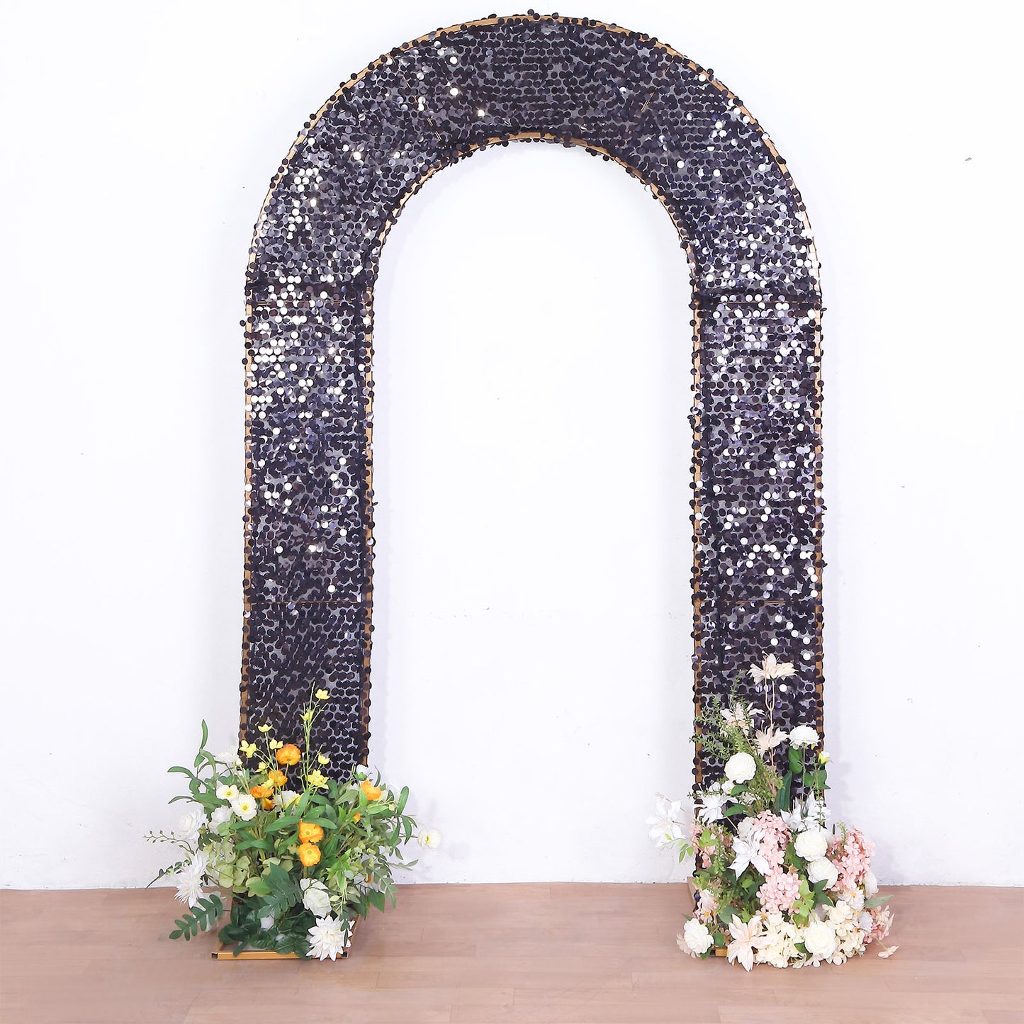 Black double-sided sequin wedding arch cover with floral arrangements.