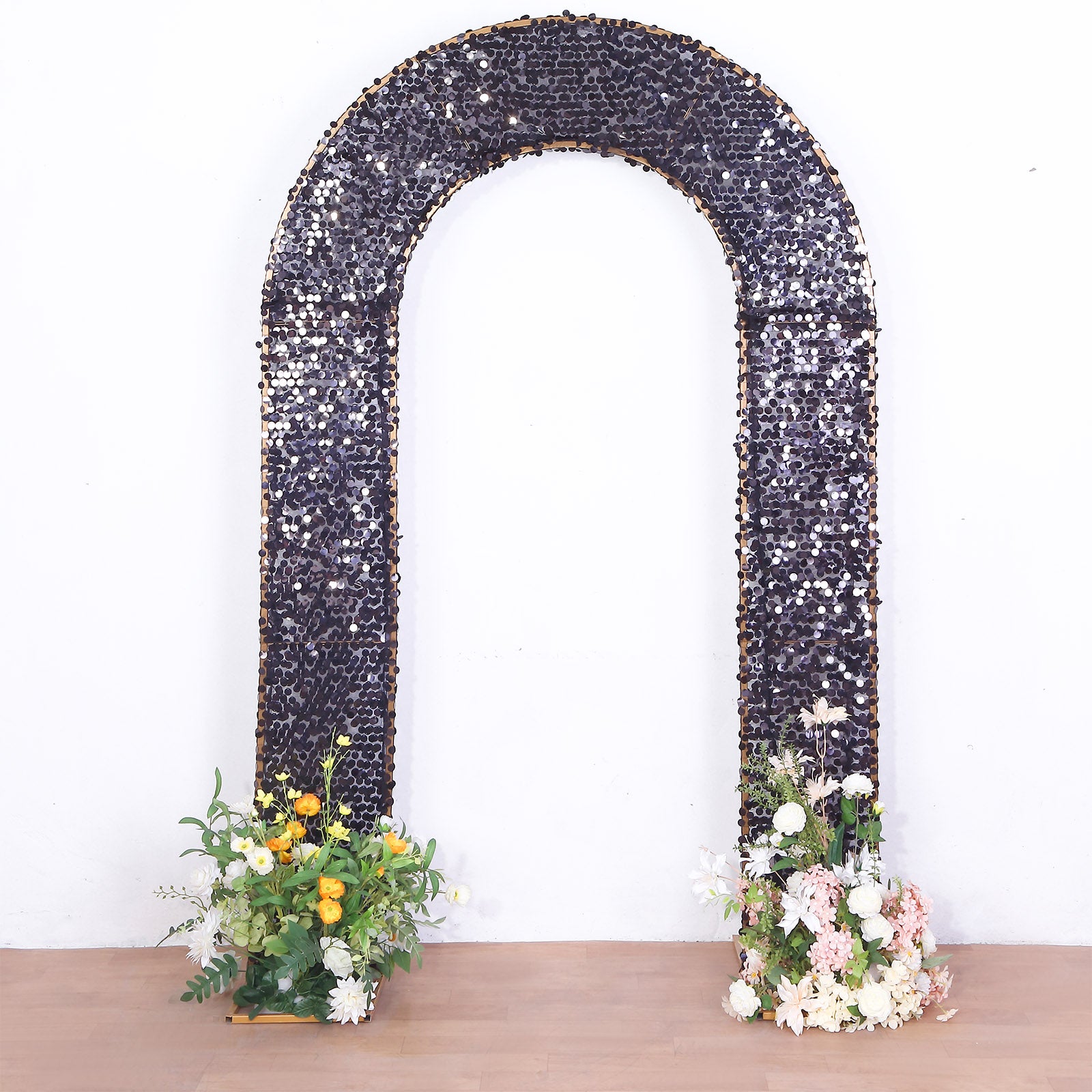 Black double-sided sequin wedding arch cover with floral arrangements.