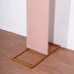 Dusty rose spandex fitted wedding arch cover on a gold frame.