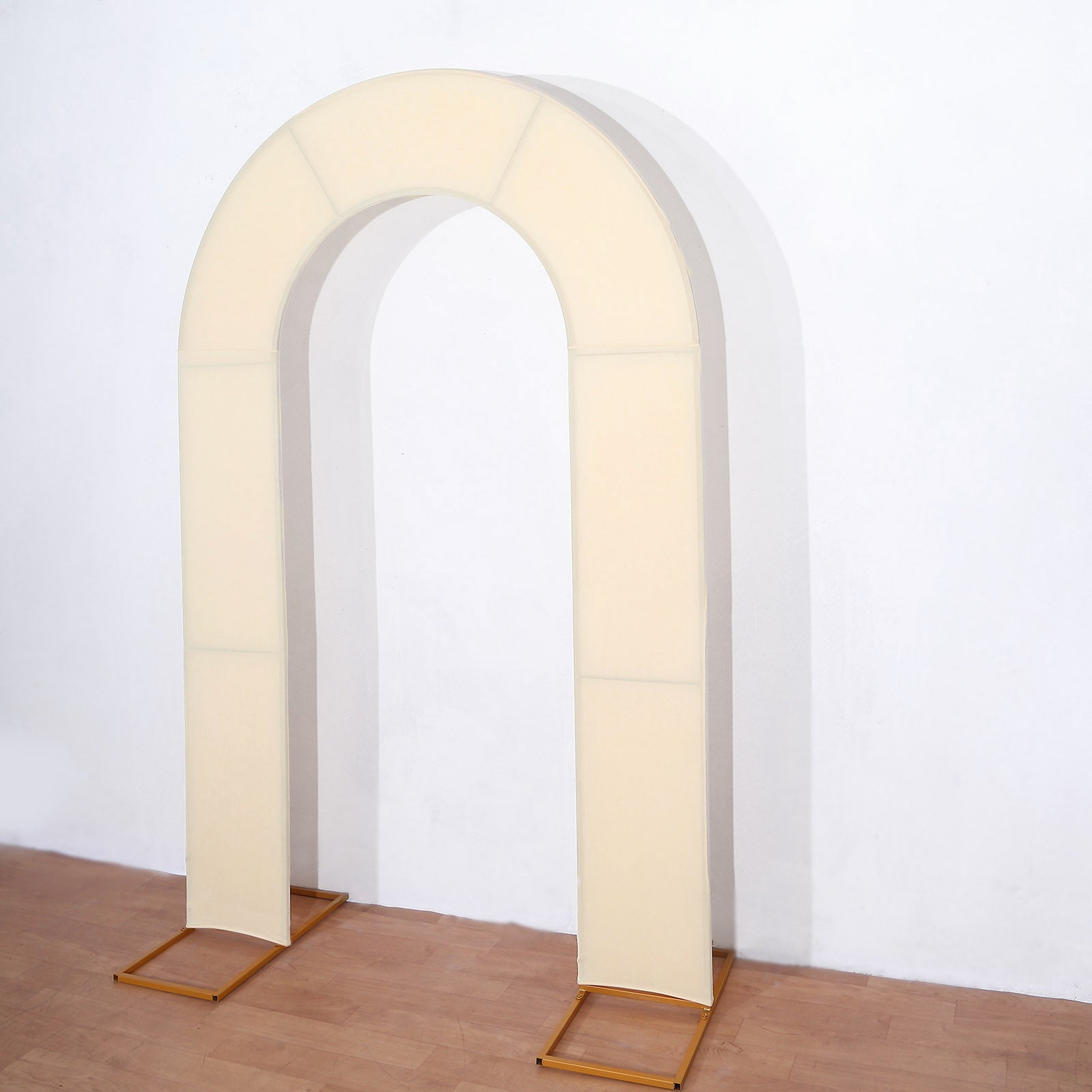 Beige spandex fitted open arch wedding arch cover backdrop.
