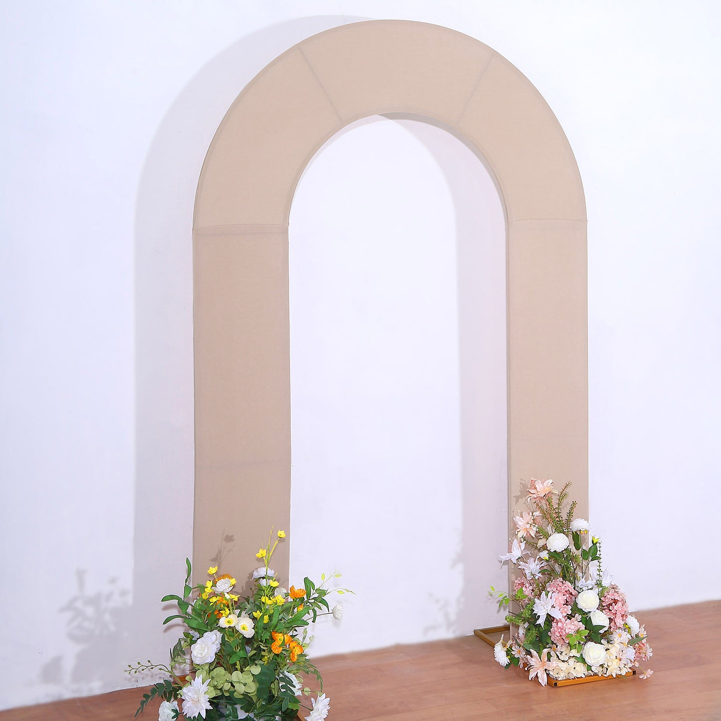 Nude spandex fitted wedding arch cover with floral arrangements.