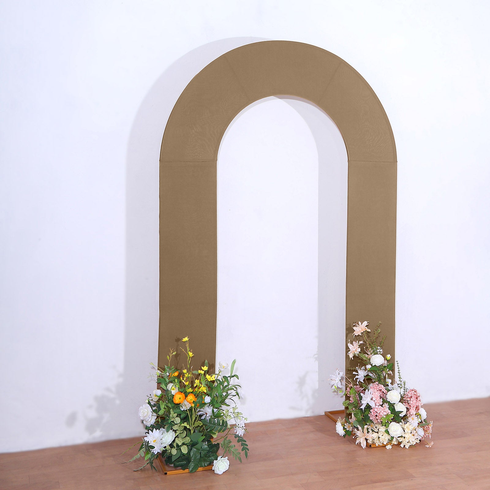 Taupe spandex fitted wedding arch cover with floral arrangements.