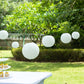 Set of 8 ivory hanging paper lanterns in assorted sizes, perfect for decoration.